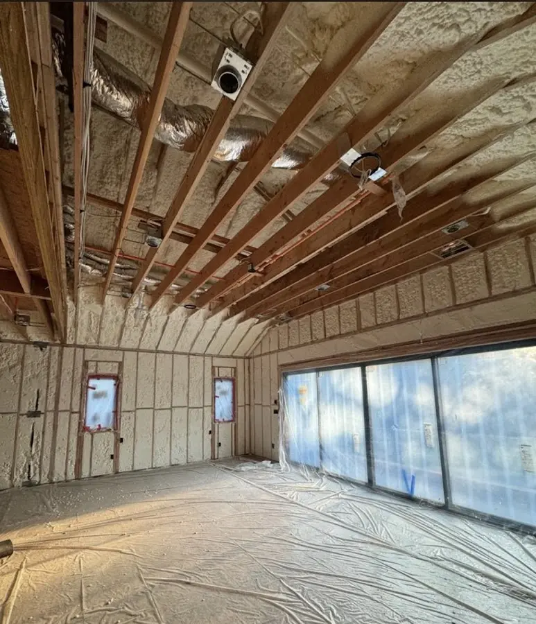Interior walls and ceiling insulated with spray foam during new construction in Fort Lee